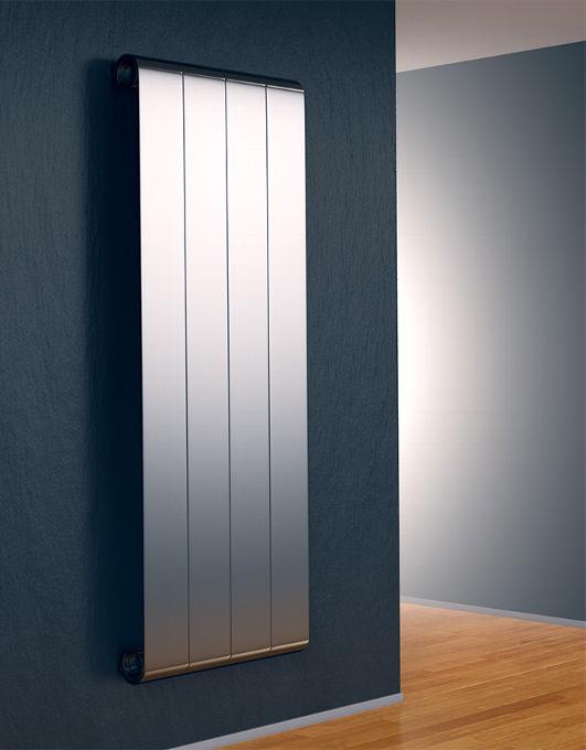 Chrome panel radiator on dark blue wall